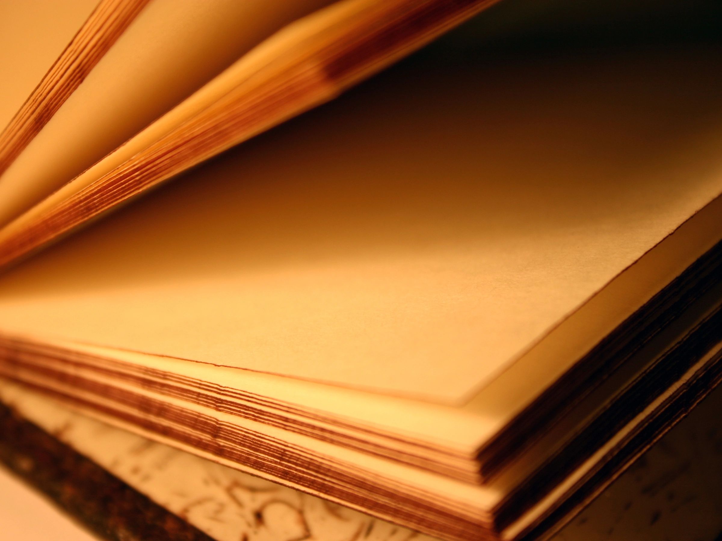 Open book on parchment-toned pages